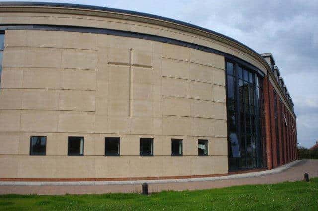 curved building built using cast stone ashlar